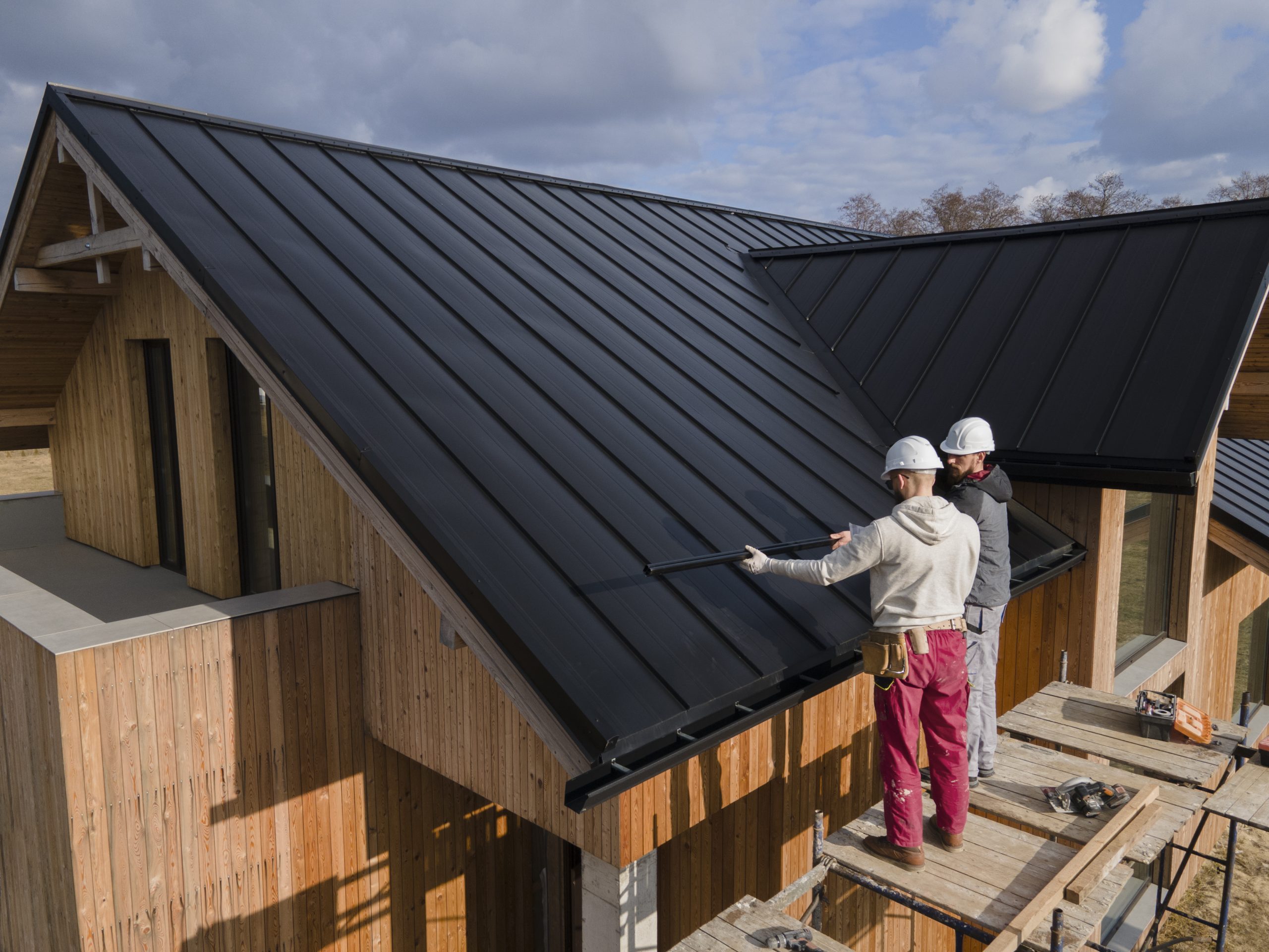 Expert Roofing Services | 5-Star Experts installing a new roof and seamless gutters.